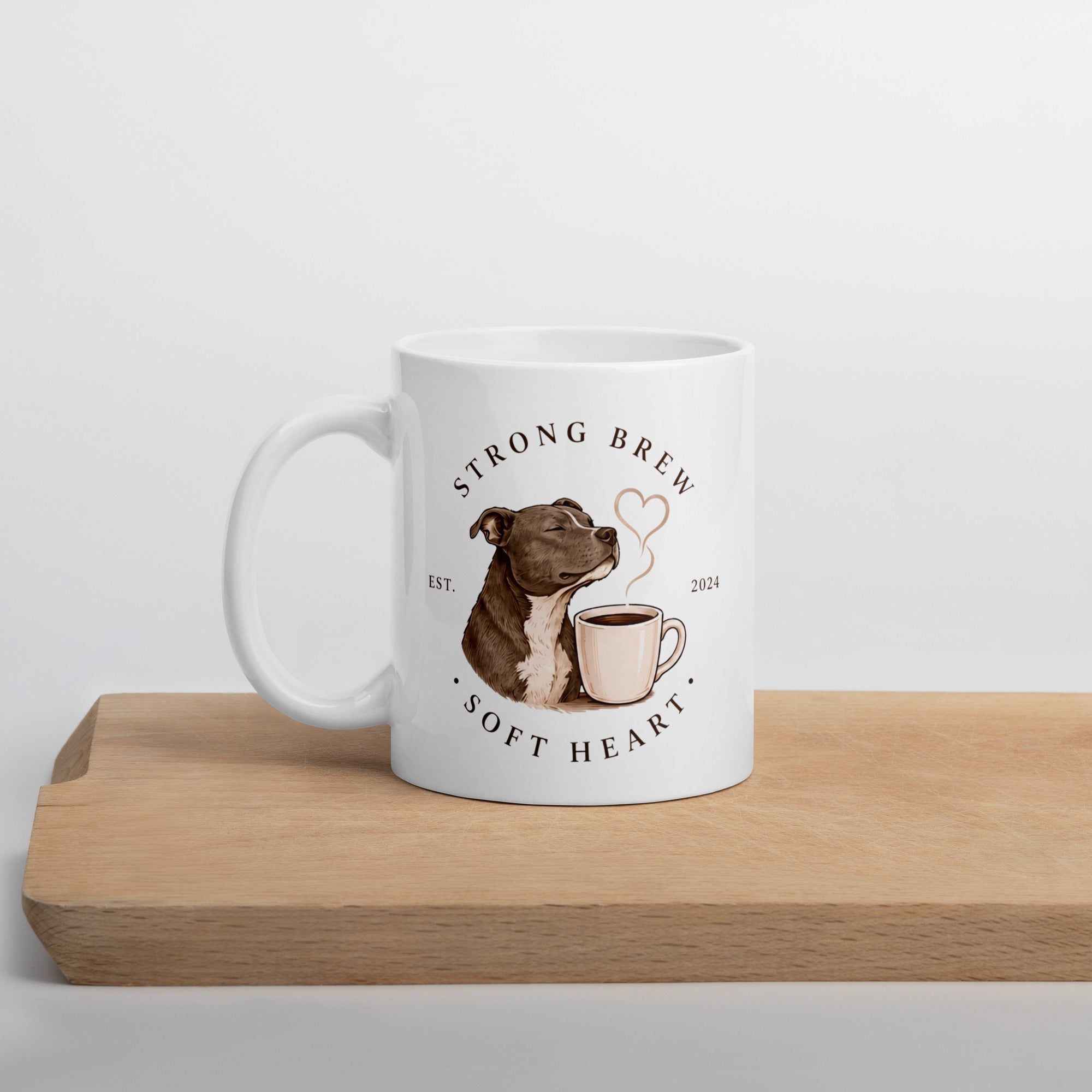 White mug with Staffy illustration on wooden board