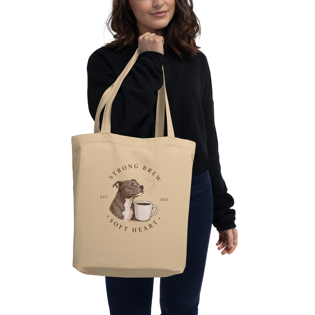 Woman holding a tote with a Staffordshire Bull Terrier on the front