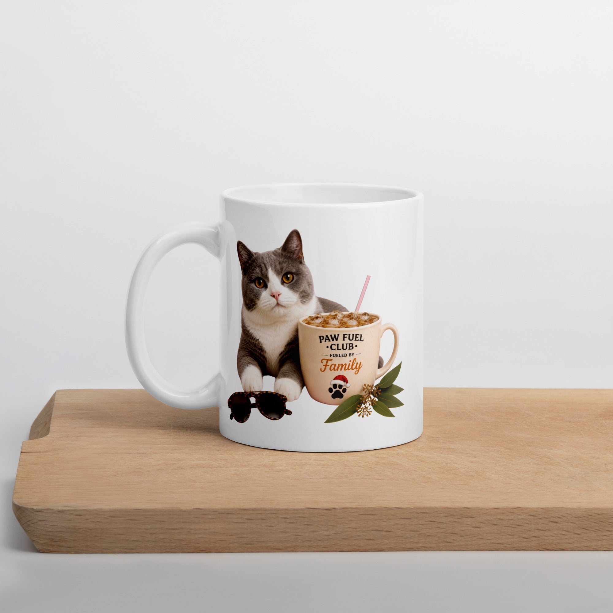 Paw Fuel Club Family ceramic coffee mug featuring a grey and white cat beside an iced coffee with sunglasses and Australian native greenery by Paw Print Society.