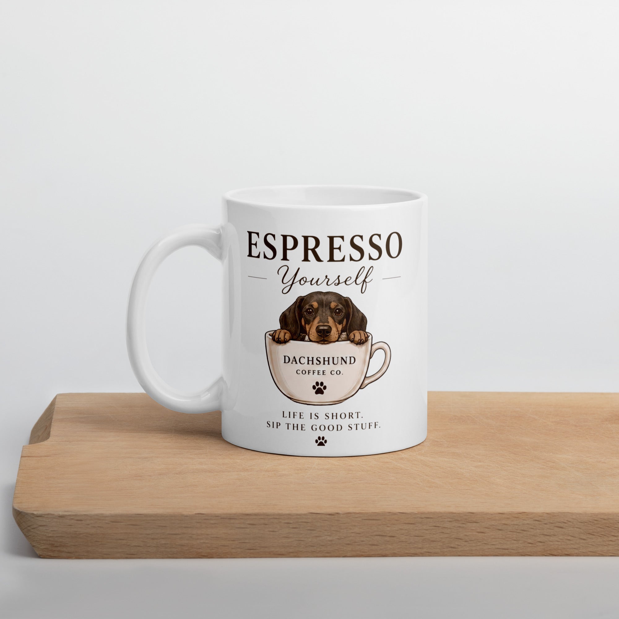 White ceramic mug with picture of a dachshund in a teacup on it with the words life is short sip the good stuff