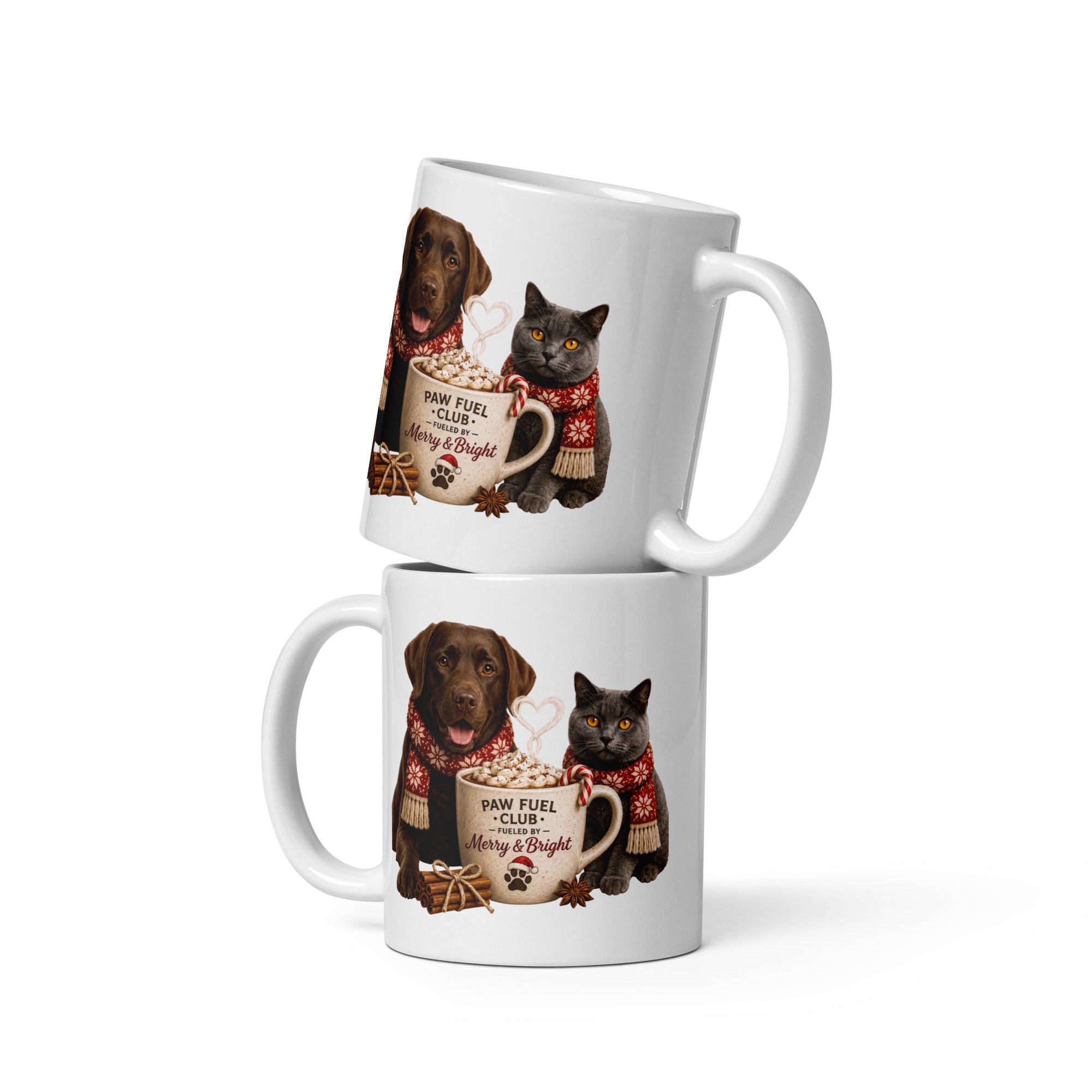 Paw Fuel Club Merry & Bright ceramic coffee mug featuring a Chocolate Labrador and British Shorthair cat wearing festive scarves beside a Christmas coffee mug by Paw Print Society.