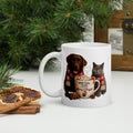 Paw Fuel Club Merry & Bright ceramic coffee mug featuring a Chocolate Labrador and British Shorthair cat wearing festive scarves beside a Christmas coffee mug by Paw Print Society.